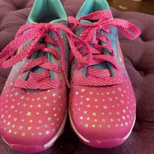 Little girl’s sparkly tennis shoes.